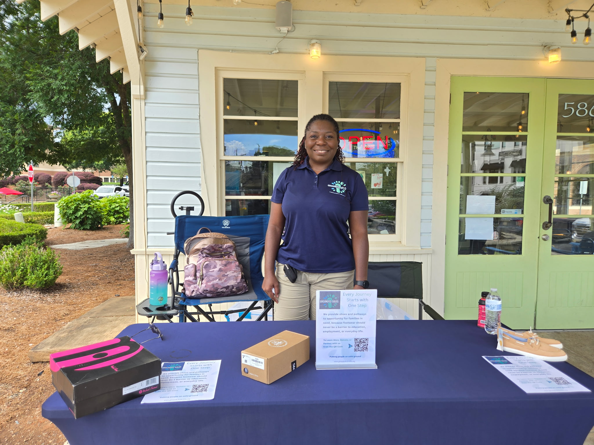 Grounded Soles Foundation representative at the outreach table at Chill Hill Ice Cream Shop