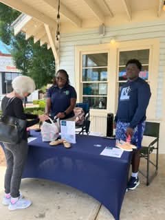 Volunteers at the Grounded Soles Foundation pop-up shoe drive table at Chill Hill Ice Cream Shop